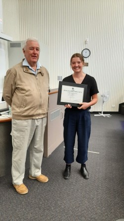 John Nevin presenting Bethanie Rice with her 2022 certificate